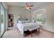 Vaulted ceilings and bay window seat are featured in this bright and spacious main bedroom at 181 S Auburn Rd, Venice, FL 34292