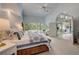 Bedroom with private entrance to an outdoor patio with pool views at 181 S Auburn Rd, Venice, FL 34292