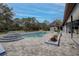 Beautiful backyard pool and patio with an outdoor kitchen area at 181 S Auburn Rd, Venice, FL 34292