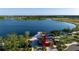 Aerial view of the 'Downtown' area featuring a splash park, lake, landscaping, and walking trail at 19240 Isadora St, Venice, FL 34293