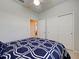 This cozy bedroom offers a comfortable bed with coordinated bedding, closet space and neutral tones, perfect for relaxation at 19240 Isadora St, Venice, FL 34293