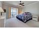 Cozy bedroom with sliding glass doors overlooking the water and a spacious wardrobe at 19240 Isadora St, Venice, FL 34293