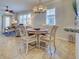 Charming dining area with seating for four, adjacent to a cozy living space at 19240 Isadora St, Venice, FL 34293