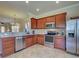 Well-equipped kitchen with stainless steel appliances and granite countertops at 19240 Isadora St, Venice, FL 34293