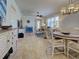Bright and airy living room with tiled floors, modern ceiling fan, and elegant furnishings at 19240 Isadora St, Venice, FL 34293