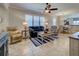 Spacious living room featuring comfortable seating, tile floors, and ample natural light at 19240 Isadora St, Venice, FL 34293