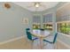 Breakfast nook with a ceiling fan and views of the manicured landscaping at 20246 Pezzana Dr, Venice, FL 34292