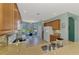 Open concept kitchen and dining area with tile flooring, perfect for Gathering gatherings at 20246 Pezzana Dr, Venice, FL 34292