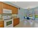 Bright kitchen featuring an oven, microwave, and breakfast nook at 20246 Pezzana Dr, Venice, FL 34292