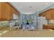 Spacious kitchen featuring stainless sink, appliances, and breakfast nook at 20246 Pezzana Dr, Venice, FL 34292