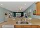 Open-concept kitchen with granite counter tops and stainless sink at 20246 Pezzana Dr, Venice, FL 34292