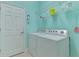 A laundry room with a washer, dryer, and wire shelving at 20246 Pezzana Dr, Venice, FL 34292