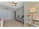 Bedroom featuring carpet floors, a ceiling fan, grey walls and a large closet at 20390 Lagente Cir, Venice, FL 34293
