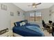 Bedroom with a window and a view, featuring gray walls, carpet floors and a ceiling fan at 20390 Lagente Cir, Venice, FL 34293