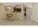Dining area looking into kitchen with stainless appliances and breakfast bar at 20390 Lagente Cir, Venice, FL 34293