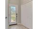 Bright townhome entryway with a decorative glass door and closet space at 20390 Lagente Cir, Venice, FL 34293