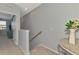 Upstairs hallway with carpet flooring and neutral walls at 20390 Lagente Cir, Venice, FL 34293