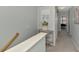 Carpeted hallway with gray walls and white trim at 20390 Lagente Cir, Venice, FL 34293