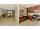 Open-concept living space with a kitchen and a living room with lots of natural light at 20390 Lagente Cir, Venice, FL 34293