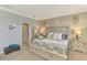 Comfortable main bedroom with white furniture and carpet floors at 20390 Lagente Cir, Venice, FL 34293