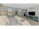 Spacious main bedroom with neutral walls and carpet flooring with lake views at 20390 Lagente Cir, Venice, FL 34293