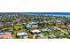 Expansive aerial view highlights the desirable community with waterfront access and in-ground pools at 205 Cavallini Dr, Nokomis, FL 34275