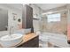 Modern bathroom featuring sleek vanity, framed mirror and tiled shower at 205 Cavallini Dr, Nokomis, FL 34275