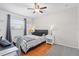 Bright bedroom featuring hardwood floors and neutral decor at 205 Cavallini Dr, Nokomis, FL 34275