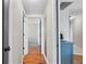 Hallway with hardwood floors and modern decor at 205 Cavallini Dr, Nokomis, FL 34275