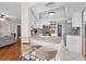 Open kitchen with breakfast bar, white cabinets, and stainless steel appliances, seamlessly connected to living area at 205 Cavallini Dr, Nokomis, FL 34275
