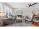 Bright and airy living room with hardwood floors and a comfortable seating area at 205 Cavallini Dr, Nokomis, FL 34275