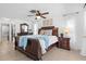 Spacious main bedroom with a large bed, dresser, and ample natural light at 205 Cavallini Dr, Nokomis, FL 34275