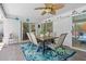 Screened-in patio offers ceiling fans and an outdoor dining space with seating for six at 205 Cavallini Dr, Nokomis, FL 34275