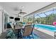Screened in patio featuring outdoor seating and a beautiful pool at 205 Cavallini Dr, Nokomis, FL 34275