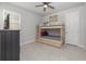 Neutral bedroom featuring a bunkbed and tile floors at 20591 Ovid Ln, Venice, FL 34293