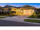 Charming single-story home featuring a two-car garage and a well-manicured lawn at 20591 Ovid Ln, Venice, FL 34293