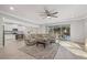 Open floor plan combining living room with kitchen and sliding door leading to outside at 20591 Ovid Ln, Venice, FL 34293