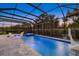 Spacious screened-in pool with spa and fun basketball hoop at 20591 Ovid Ln, Venice, FL 34293