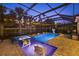 A stunning screened-in pool and spa, perfect for evening relaxation at 20591 Ovid Ln, Venice, FL 34293