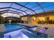 Stunning outdoor pool and patio area with a screened enclosure, perfect for relaxation and entertaining at 20591 Ovid Ln, Venice, FL 34293