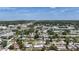 An aerial view shows the property's location, showcasing lush surroundings and proximity to urban conveniences at 2108 Lee Ln, Sarasota, FL 34231