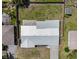Aerial view of the property showcasing the home, driveway, and well-maintained surrounding landscape at 2108 Lee Ln, Sarasota, FL 34231