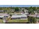 An aerial view showcases this home's backyard, surrounded by a wooden fence and mature trees providing shade and privacy at 2108 Lee Ln, Sarasota, FL 34231