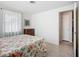 Bright bedroom with light walls, a window, and terrazzo floors at 2108 Lee Ln, Sarasota, FL 34231