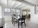 Bright dining room featuring modern ceiling, ample natural light, and a sleek black dining set for sophisticated meals at 2108 Lee Ln, Sarasota, FL 34231