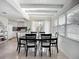 Bright dining room featuring modern ceiling, ample natural light, and a sleek black dining set at 2108 Lee Ln, Sarasota, FL 34231