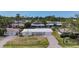 An exterior aerial view showing a charming single-story home with a metal roof in a desirable neighborhood at 2108 Lee Ln, Sarasota, FL 34231