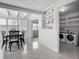 Laundry room features built-in shelving, laundry machines, and ample storage at 2108 Lee Ln, Sarasota, FL 34231