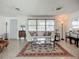 Bright living room with terrazzo floors, a comfortable sofa, and ample natural light at 2108 Lee Ln, Sarasota, FL 34231