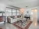 Inviting living room featuring terrazzo floors, a large window, and seamless flow at 2108 Lee Ln, Sarasota, FL 34231